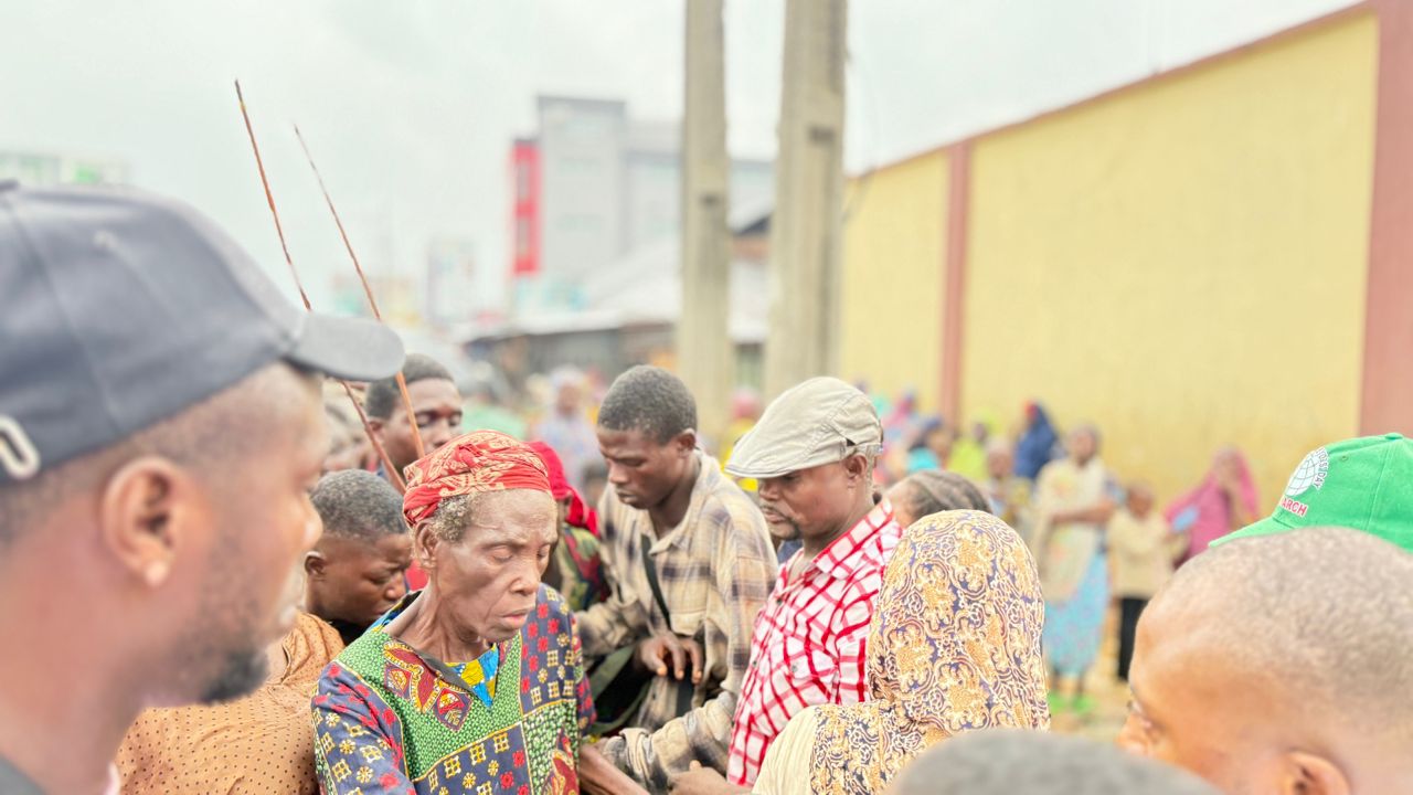 Foundation members interacting with community members outdoors - ELIZABETH OSARIEMEN JOHN FOUNDATION making impact in Nigerian communities